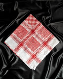 An imaamad red and white scarf folded