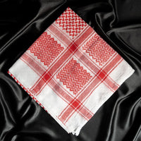 An imamaad red and white scarf folded