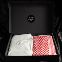 A package containing a white emirati thobe and an imaamad, red and white scarf